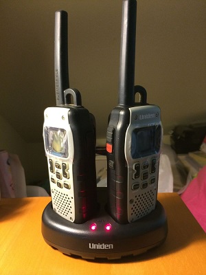 Uniden GMR5089 submersible walkie talkie on charging stand